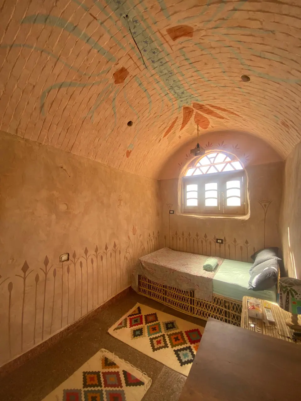 A single bed beneath a vaulted ceiling, a peaceful space to rest